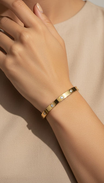 Gold bezel-set diamond bangle