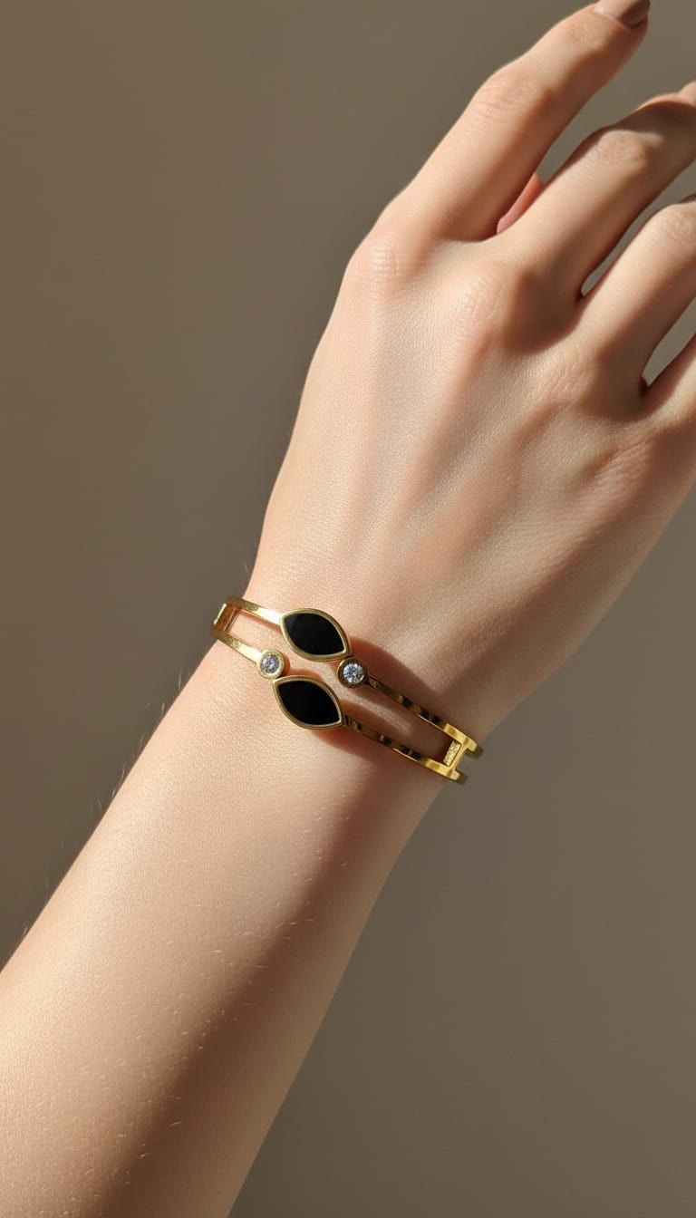 Gold double bangle with black marquise stones