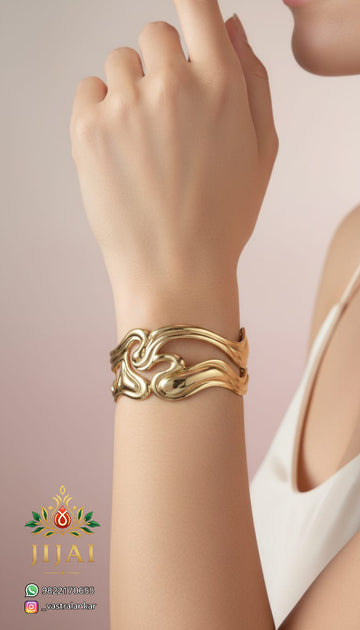 Gold swirl wave cuff bracelet