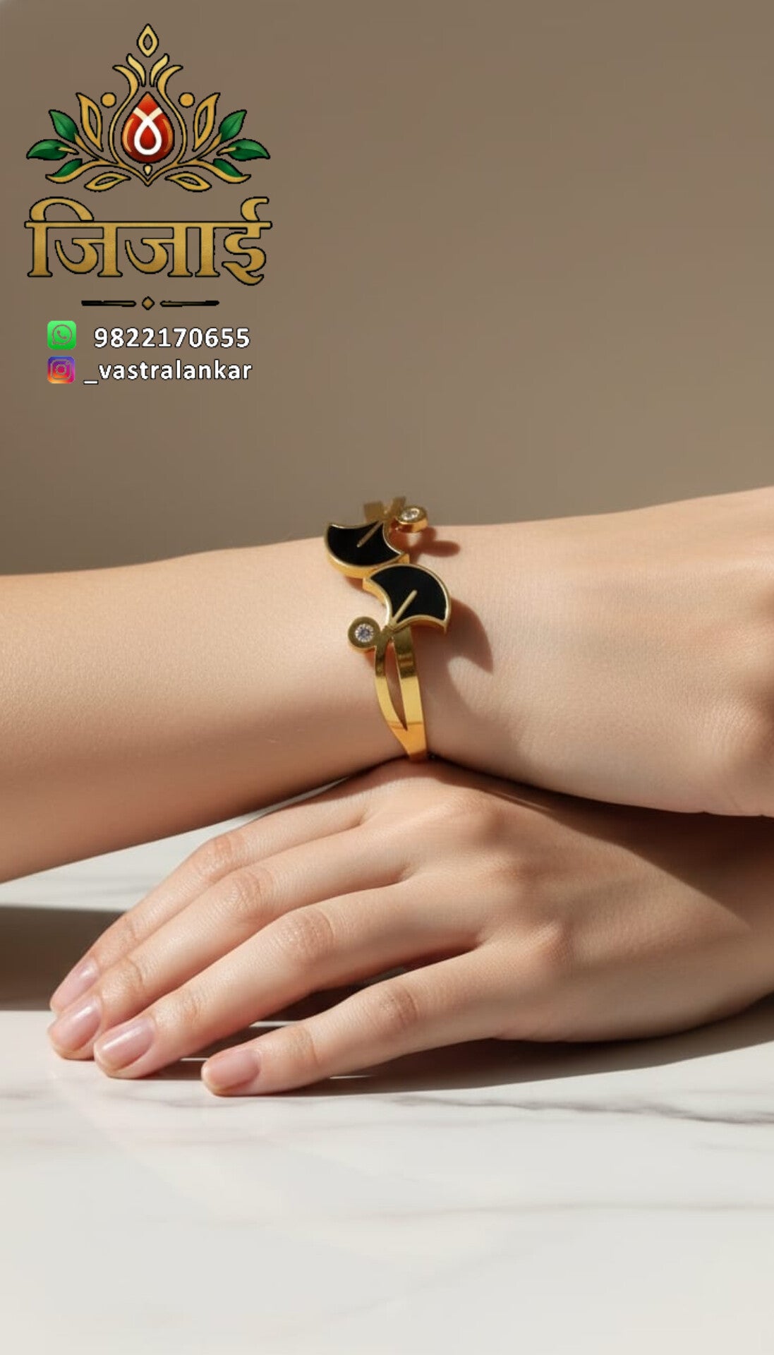 Gold bangle with black wave motifs