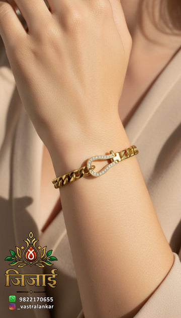 Gold curb chain bracelet with pave horseshoe clasp